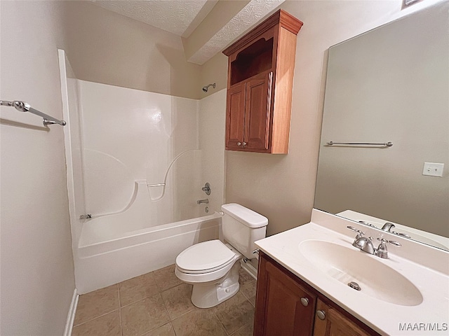 full bathroom featuring vanity, bathing tub / shower combination, tile patterned floors, toilet, and a textured ceiling