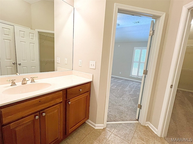 bathroom with vanity and tile patterned floors