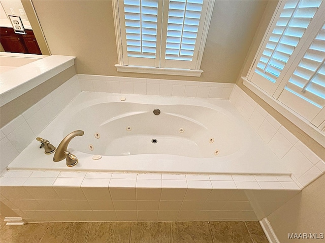 bathroom featuring a relaxing tiled tub