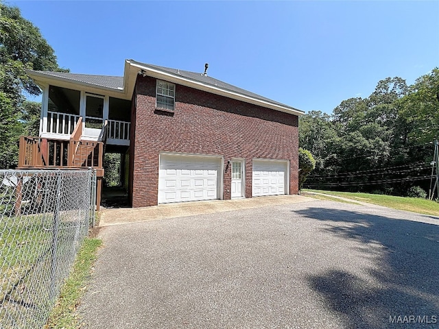 view of property exterior with a garage