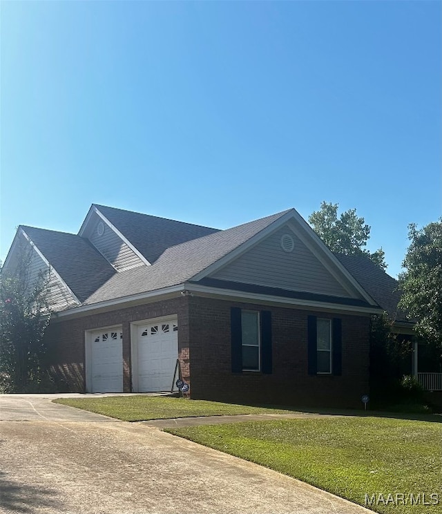 single story home with a front yard and a garage