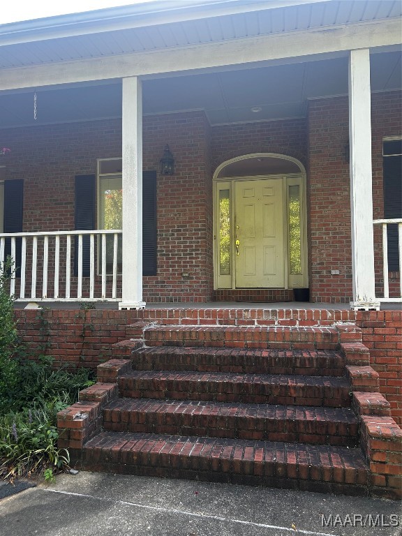 doorway to property featuring a porch