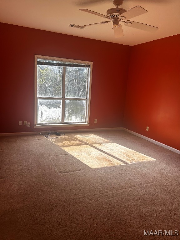 carpeted empty room with ceiling fan