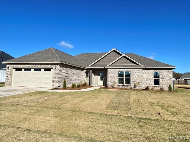 view of front of home featuring a garage and a front yard