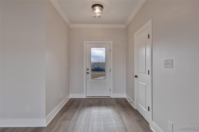 doorway to outside with hardwood / wood-style flooring and crown molding