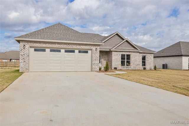 view of front of house featuring a front yard and a garage