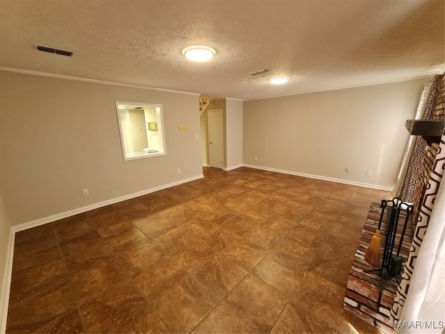 interior space with tile patterned floors, a textured ceiling, and ornamental molding