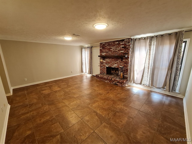 unfurnished living room with tile patterned floors, brick wall, a textured ceiling, and a brick fireplace