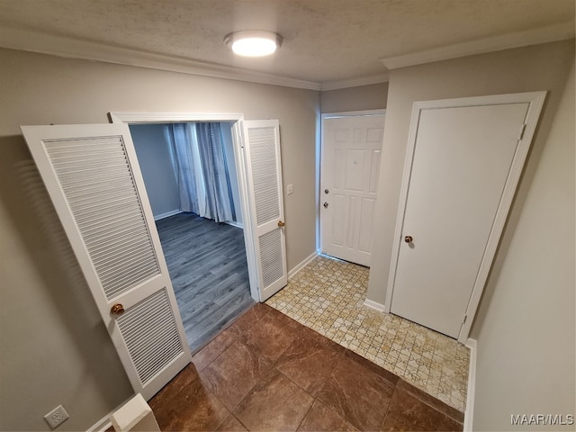 interior space with ornamental molding and tile patterned floors