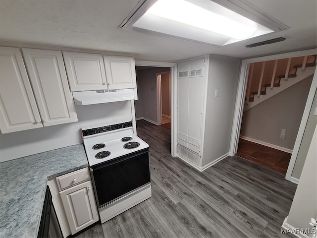 kitchen featuring white cabinetry, hardwood / wood-style flooring, and electric range