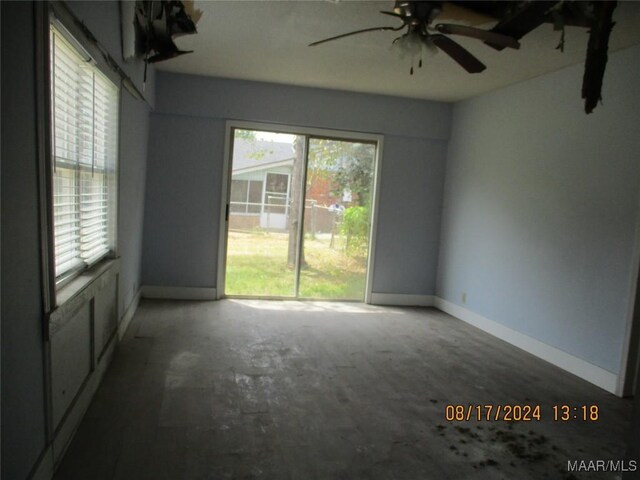 unfurnished room featuring ceiling fan