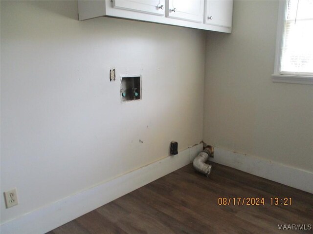 laundry room with hookup for a washing machine, wood-type flooring, and cabinets