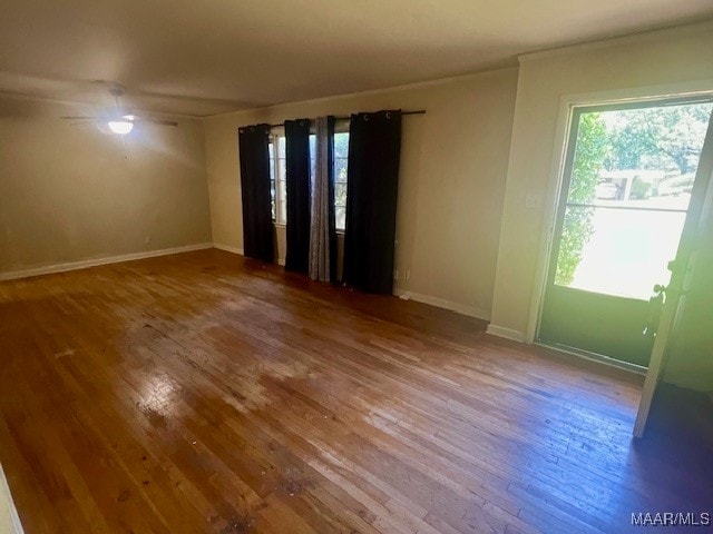 spare room with ceiling fan and hardwood / wood-style flooring