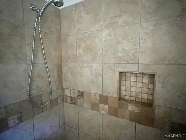 room details with a tile shower