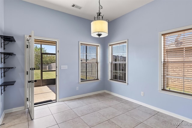 spare room with light tile patterned floors