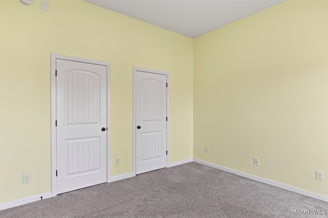 unfurnished bedroom featuring carpet