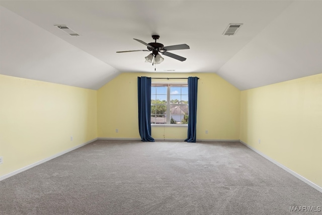 bonus room with ceiling fan, lofted ceiling, and light carpet