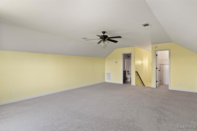 bonus room with carpet flooring, ceiling fan, and vaulted ceiling