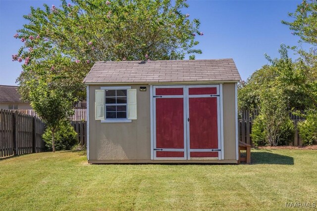 view of outdoor structure with a lawn