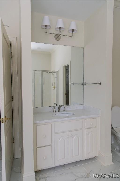 full bathroom with toilet, marble finish floor, a shower stall, and vanity