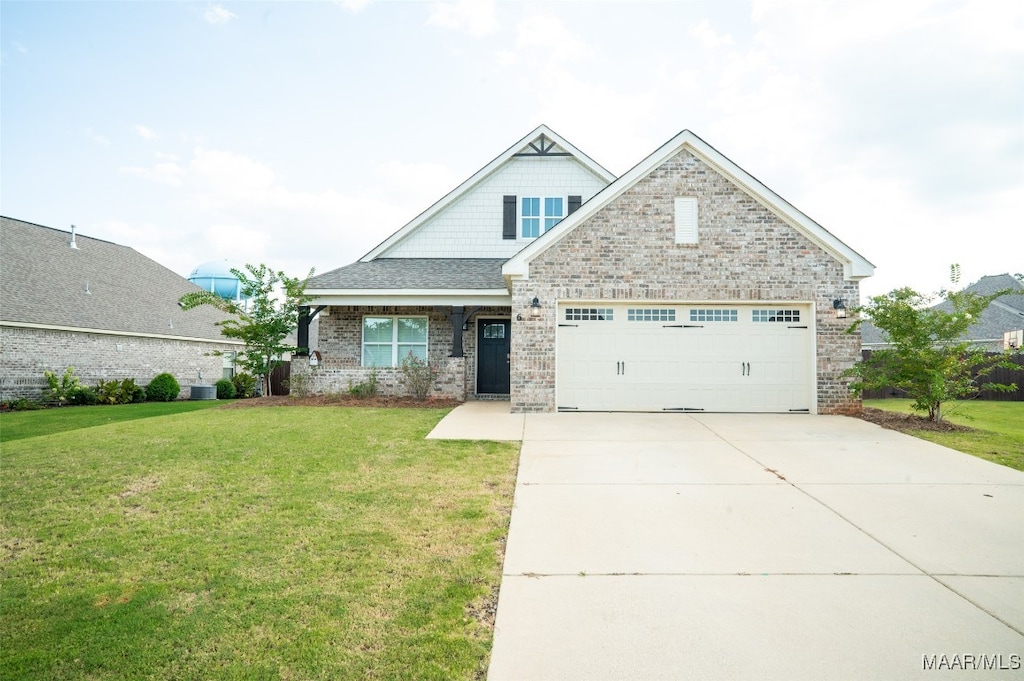 craftsman inspired home with central AC unit and a front yard