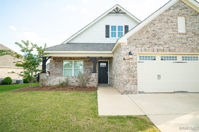 craftsman-style home with central air condition unit and a front yard