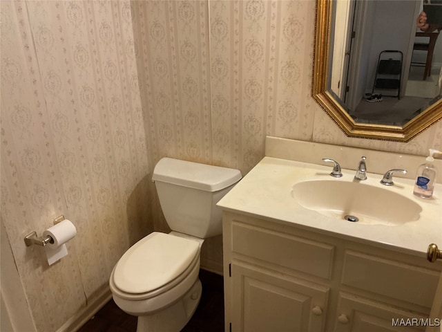 bathroom with vanity and toilet