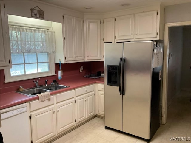 kitchen featuring white cabinets, a sink, white dishwasher, and stainless steel fridge with ice dispenser