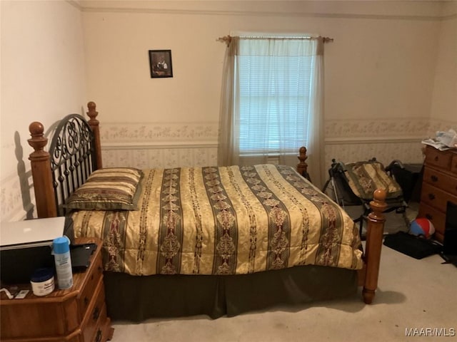 carpeted bedroom with wallpapered walls