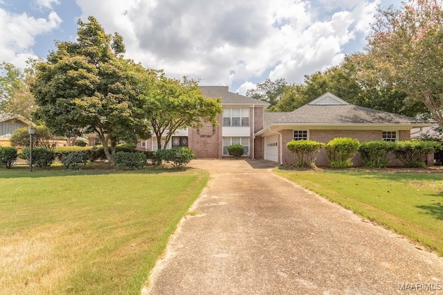 view of front facade featuring a garage and a front lawn