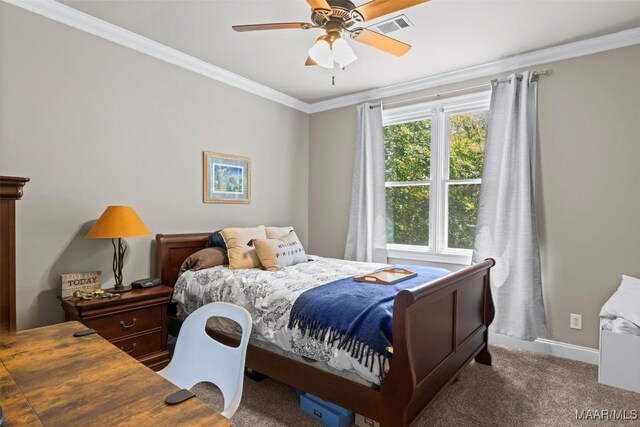 carpeted bedroom featuring ceiling fan and ornamental molding