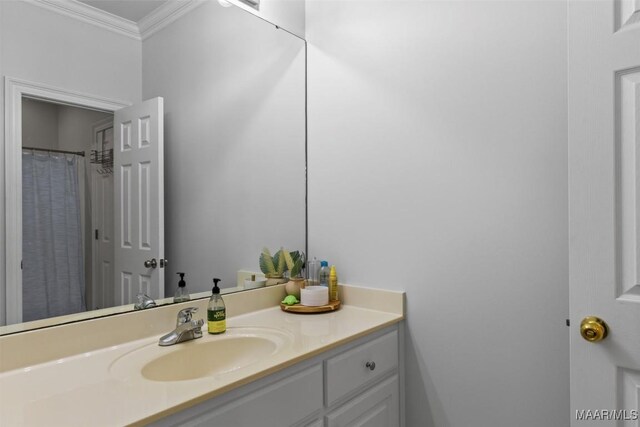 bathroom featuring vanity and ornamental molding