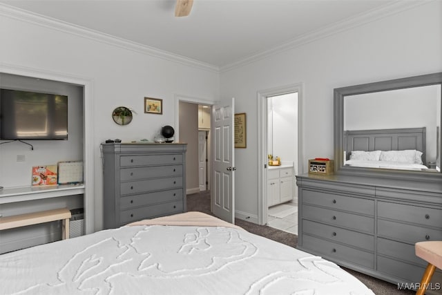 carpeted bedroom featuring ceiling fan, crown molding, and ensuite bath