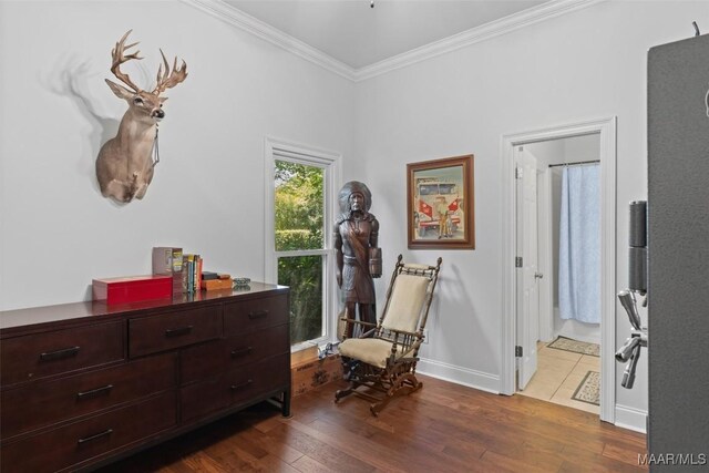 sitting room featuring hardwood / wood-style floors and ornamental molding