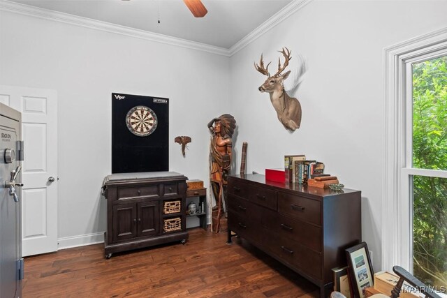 interior space with ceiling fan, crown molding, and dark hardwood / wood-style flooring