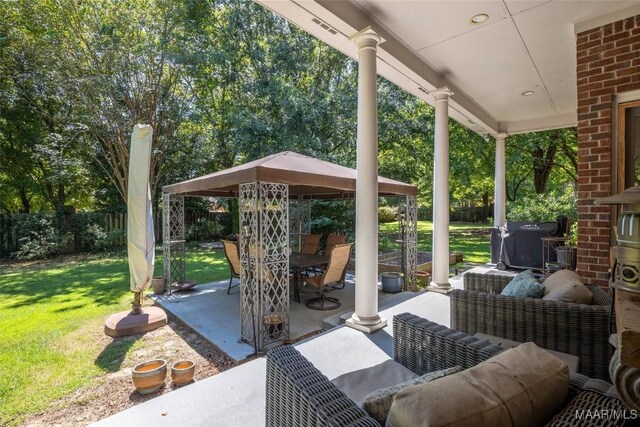 view of patio / terrace featuring a gazebo, grilling area, and an outdoor living space