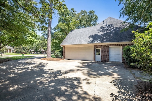 view of side of property with a garage