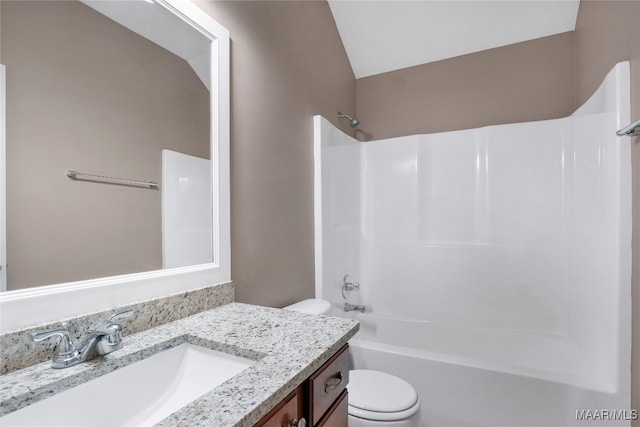 full bathroom featuring bathtub / shower combination, vanity, and toilet