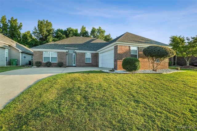 ranch-style house with a front lawn and a garage