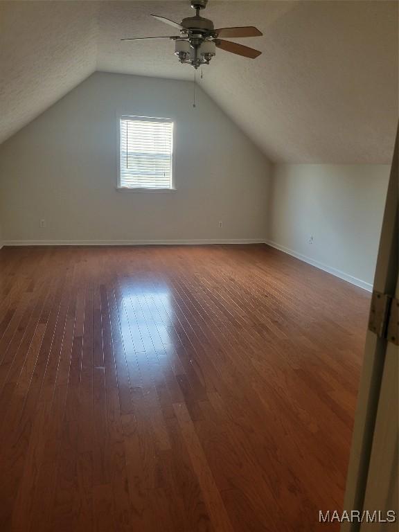 1315 Richton Rd, Montgomery, AL 36117 - bonus room with a ceiling fan, hardwood / wood-style floors, lofted ceiling, and baseboards