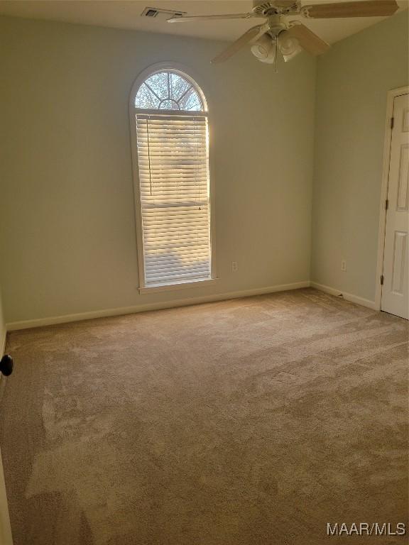 1315 Richton Rd, Montgomery, AL 36117 - carpeted empty room featuring ceiling fan and baseboards