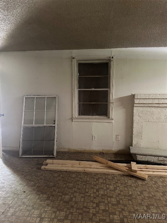 empty room with a textured ceiling