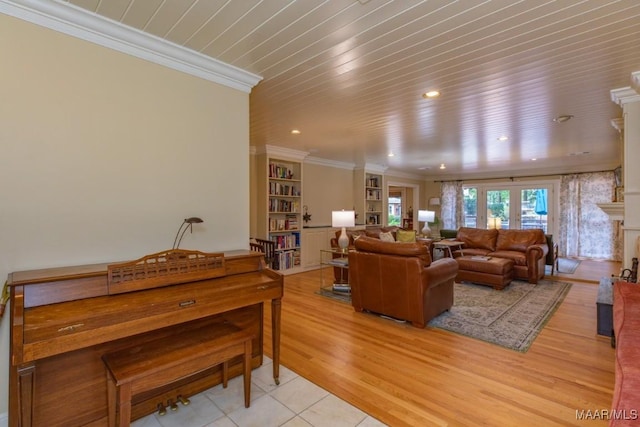 living room featuring wooden ceiling, a fireplace, ornamental molding, french doors, and light wood-type flooring