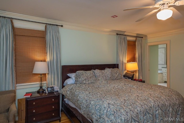 bedroom featuring ceiling fan and crown molding