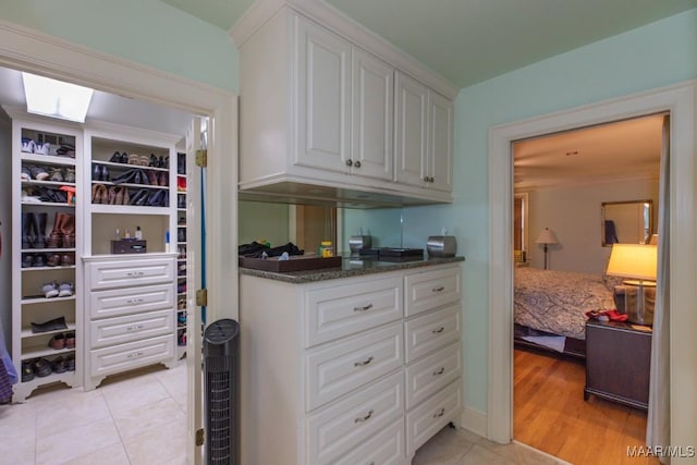 spacious closet with light tile patterned flooring