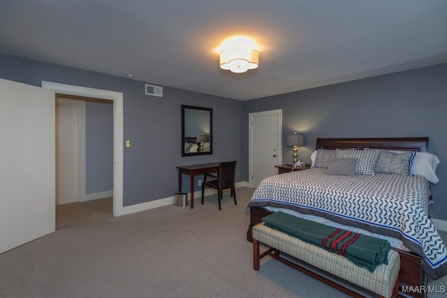 carpeted bedroom with baseboards and visible vents