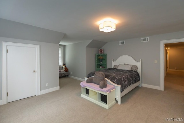 bedroom featuring light carpet, visible vents, and baseboards