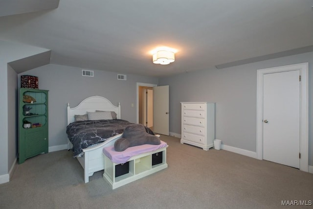 bedroom featuring carpet floors, visible vents, and baseboards