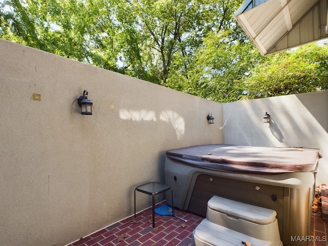 view of patio / terrace featuring a hot tub