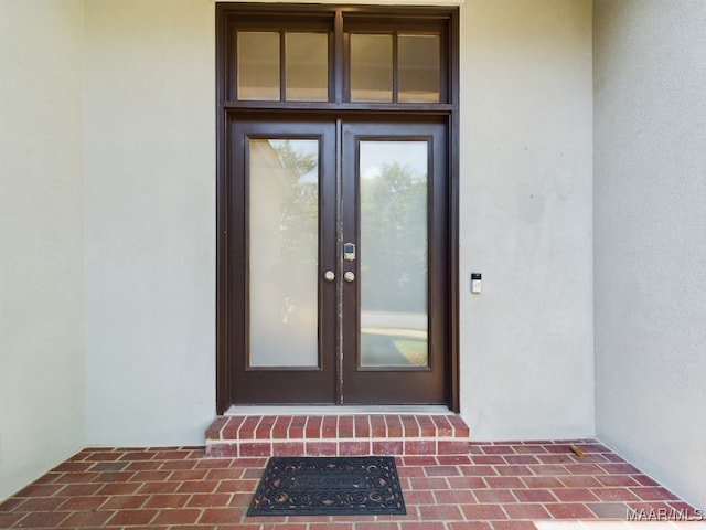 property entrance featuring french doors